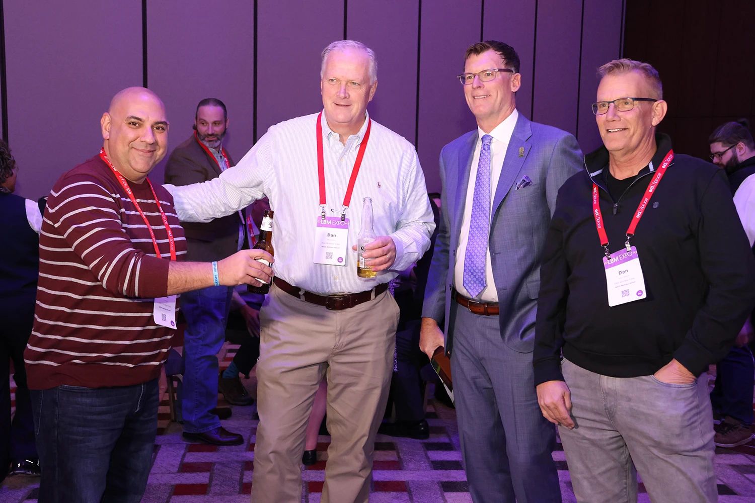 People posing for photo at holiday reception