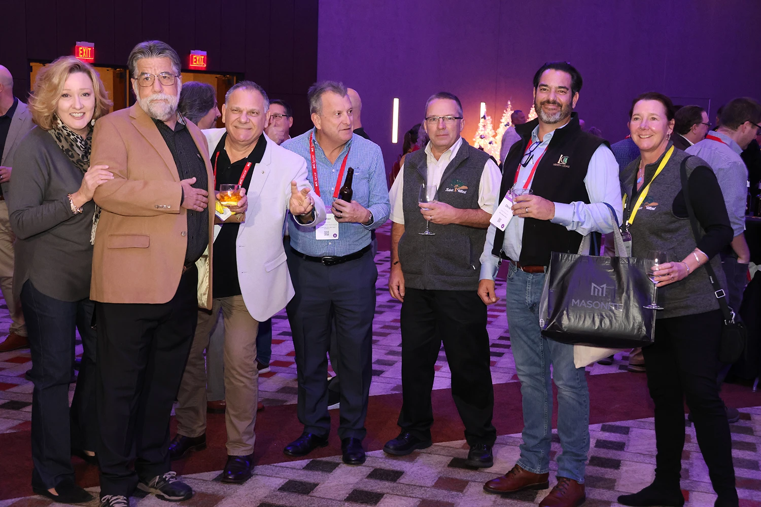 People posing for photo at holiday reception